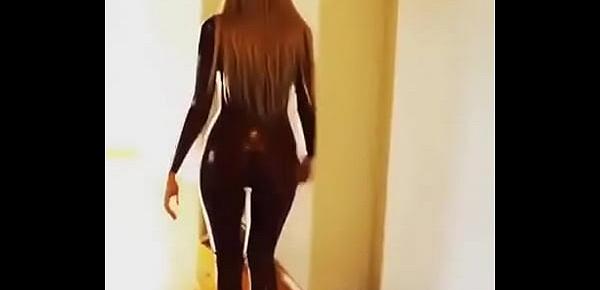  Sexy babe walks in latex catsuit